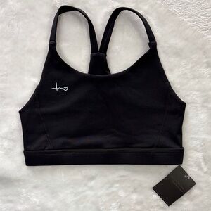Never Skip Monday Black Heartbeat Graphic
Sports Bra | size Small NWT